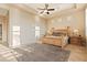 Spacious main bedroom with large windows, high ceilings, and wood flooring at 2554 N Tambor --, Mesa, AZ 85207
