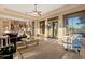 Sunlit living room with sliding doors to patio and views of the backyard at 2554 N Tambor --, Mesa, AZ 85207