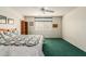 Bedroom features green carpet, a ceiling fan, and window blinds at 11347 E Neville Ave, Mesa, AZ 85209