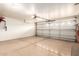 Spacious garage with white walls and epoxy flooring at 11347 E Neville Ave, Mesa, AZ 85209