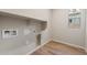 Convenient laundry room with built-in shelving at 22508 E Orchard Ln, Queen Creek, AZ 85142