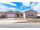 New construction home with a two-car garage and desert landscaping at 26092 S 226Th St, Queen Creek, AZ 85142