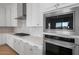 Stainless steel appliances and white shaker cabinets in this kitchen at 26092 S 226Th St, Queen Creek, AZ 85142