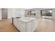 Kitchen island with white cabinets and a large sink at 26092 S 226Th St, Queen Creek, AZ 85142