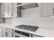 Modern kitchen with gray cabinets, stainless steel appliances, and quartz countertops at 26114 S 226Th St, Queen Creek, AZ 85142