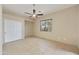 Bedroom with tile flooring, ceiling fan and double doors at 28505 N 146Th St, Scottsdale, AZ 85262