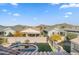 Aerial view of house showcasing backyard oasis with pool and mountain views at 518 E Balao Dr, Phoenix, AZ 85085