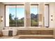 Spa-like bathroom with large soaking tub and mountain views at 6623 N Hillside Dr, Paradise Valley, AZ 85253