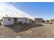 View of the house exterior and backyard with storage shed at 8304 E Desert Trl, Mesa, AZ 85208