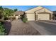 Two-car garage, desert landscaping, and light-colored exterior at 1785 S Nebraska St, Chandler, AZ 85286