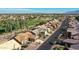 Aerial view of a neighborhood with houses and a golf course at 3353 N Snead Dr, Goodyear, AZ 85395