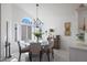 Kitchen dining area with a round glass table and six chairs at 3353 N Snead Dr, Goodyear, AZ 85395