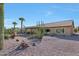 Landscaped backyard with desert plants and gravel at 3353 N Snead Dr, Goodyear, AZ 85395