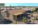 Backyard aerial view showing patio, landscaping, and mountain views at 3353 N Snead Dr, Goodyear, AZ 85395