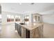 Kitchen island with granite countertop and sink overlooking the dining area at 25952 S 224Th Pl, Queen Creek, AZ 85142