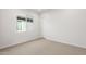 Bright bedroom with neutral walls and carpet and window at 25952 S 224Th Pl, Queen Creek, AZ 85142