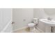 Clean bathroom with pedestal sink and toilet at 25952 S 224Th Pl, Queen Creek, AZ 85142