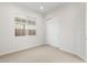 Spacious bedroom with neutral walls and carpet, door to closet at 25952 S 224Th Pl, Queen Creek, AZ 85142
