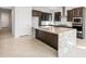 Large kitchen island with granite countertop and seating space at 25952 S 224Th Pl, Queen Creek, AZ 85142
