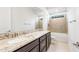 Bathroom with double sinks, granite countertop and bathtub at 25952 S 224Th Pl, Queen Creek, AZ 85142