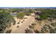 Stunning aerial view of a luxurious home with a gated driveway at 8000 E Mariposa Grande Dr, Scottsdale, AZ 85255