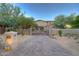 Tuscan style home with gated entry and brick driveway at 8000 E Mariposa Grande Dr, Scottsdale, AZ 85255