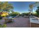Expansive backyard with a large pool, patio, and outdoor kitchen at 8000 E Mariposa Grande Dr, Scottsdale, AZ 85255