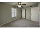 Bright bedroom with ceiling fan, window shutters, and carpet flooring at 15008 N 48Th Pl, Scottsdale, AZ 85254