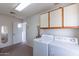 Laundry room with washer, dryer, and access to the outside at 13047 W Peach Blossom Dr, Sun City West, AZ 85375