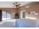 Spacious main bedroom with high ceiling and access to the patio at 13047 W Peach Blossom Dr, Sun City West, AZ 85375