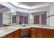 Bathroom with double vanity and large mirrored vanity at 13047 W Peach Blossom Dr, Sun City West, AZ 85375