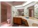 Bathroom features double sinks, a shower, and a toilet at 13047 W Peach Blossom Dr, Sun City West, AZ 85375