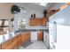 Kitchen with wood cabinets, granite countertops, and stainless steel appliances at 13047 W Peach Blossom Dr, Sun City West, AZ 85375