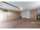 Garage with ample storage cabinets and flooring at 13047 W Peach Blossom Dr, Sun City West, AZ 85375