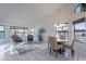 Dining area with a round table and chairs, and large windows with water views at 13047 W Peach Blossom Dr, Sun City West, AZ 85375