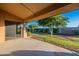 Covered patio overlooking a well-manicured backyard at 13047 W Peach Blossom Dr, Sun City West, AZ 85375