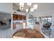Bright dining area with built-in shelves and backyard access at 13047 W Peach Blossom Dr, Sun City West, AZ 85375