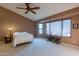 Main bedroom features a ceiling fan and ample natural light at 13047 W Peach Blossom Dr, Sun City West, AZ 85375