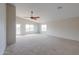 Large main bedroom with access to a balcony at 1749 E Wildflower Ln, Casa Grande, AZ 85122