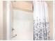 Clean bathroom with shower/tub combo and a floral shower curtain at 18774 N Ibis Way, Maricopa, AZ 85138