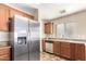Modern kitchen with stainless steel appliances and ample cabinet space at 18774 N Ibis Way, Maricopa, AZ 85138
