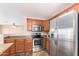 Modern kitchen featuring stainless steel appliances and ample cabinetry at 18774 N Ibis Way, Maricopa, AZ 85138