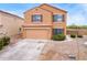 Two-story house with attached garage and neutral color scheme at 18774 N Ibis Way, Maricopa, AZ 85138