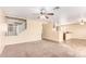 Open living room with a view of the kitchen and dining area at 18774 N Ibis Way, Maricopa, AZ 85138