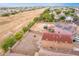 House with large backyard, trampoline, and solar panels; additional homes visible at 18774 N Ibis Way, Maricopa, AZ 85138