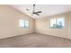 Bright bedroom featuring a ceiling fan and neutral decor at 18774 N Ibis Way, Maricopa, AZ 85138