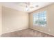 Cozy bedroom with ceiling fan and window coverings at 18774 N Ibis Way, Maricopa, AZ 85138