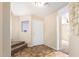 Bright entryway with tiled floors and staircase at 18774 N Ibis Way, Maricopa, AZ 85138