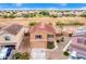 Two-story house with attached garage, solar panels, and a view of the surrounding neighborhood at 18774 N Ibis Way, Maricopa, AZ 85138