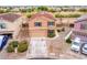 Aerial view of two-story house with driveway and landscaping at 18774 N Ibis Way, Maricopa, AZ 85138
